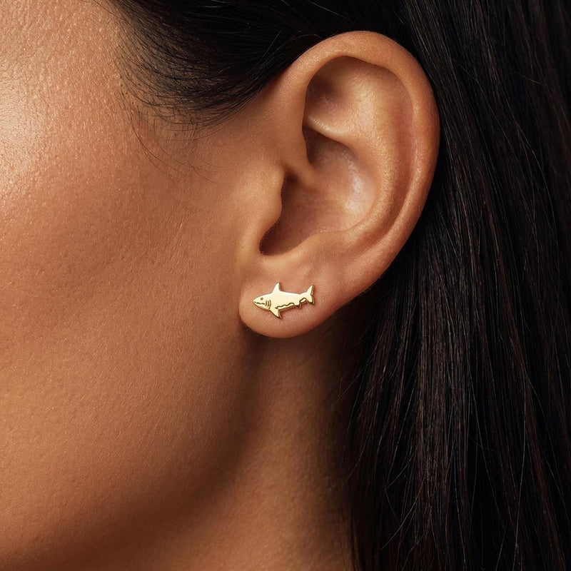 Pair of small shark stud earrings in gold with dorsal fin and curved tail (8 of 14)