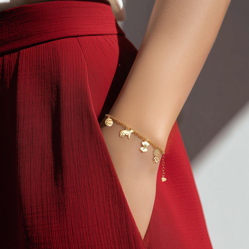 Fine gold chain bracelet with several small Greek letter and symbol charms (8 of 13)