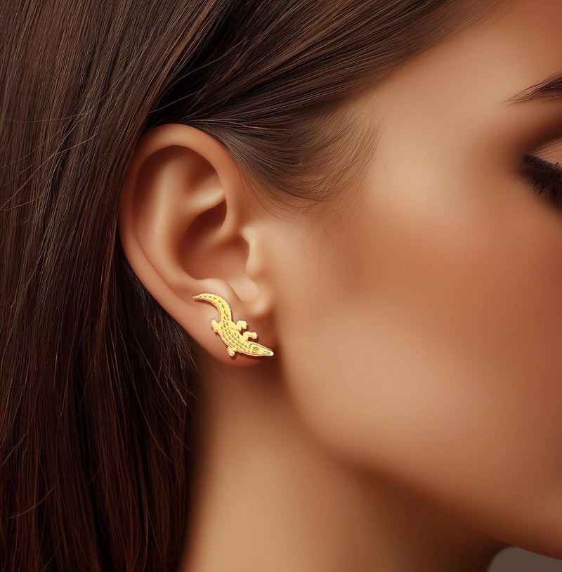 Gold alligator ear climber earrings with curved tails, shown as a pair. (10 of 12)