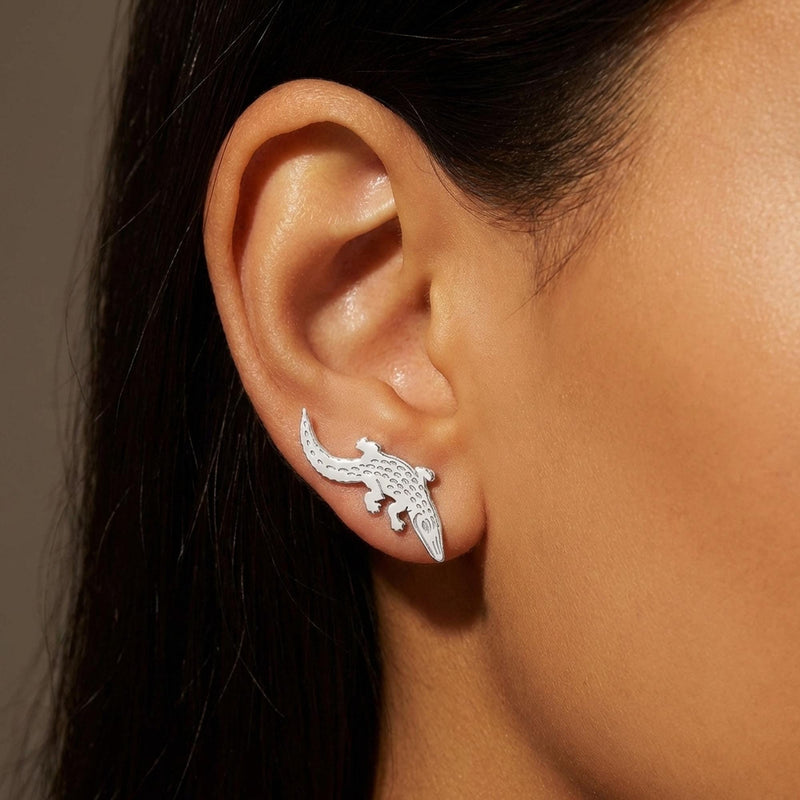 Gold alligator ear climber earrings with curved tails, shown as a pair. (3 of 12)