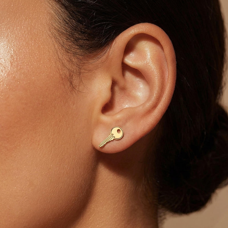 Pair of narrow old fashioned house key stud earrings in gold (4 of 9)