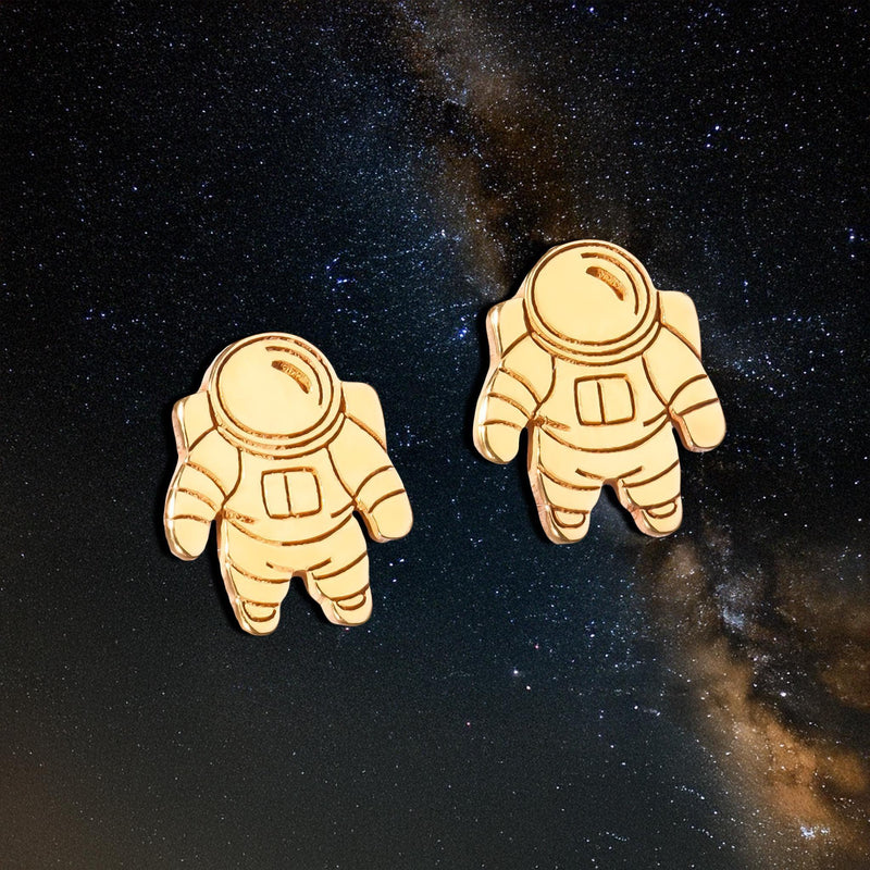 Pair of small gold astronaut stud earrings shown front on (3 of 14)