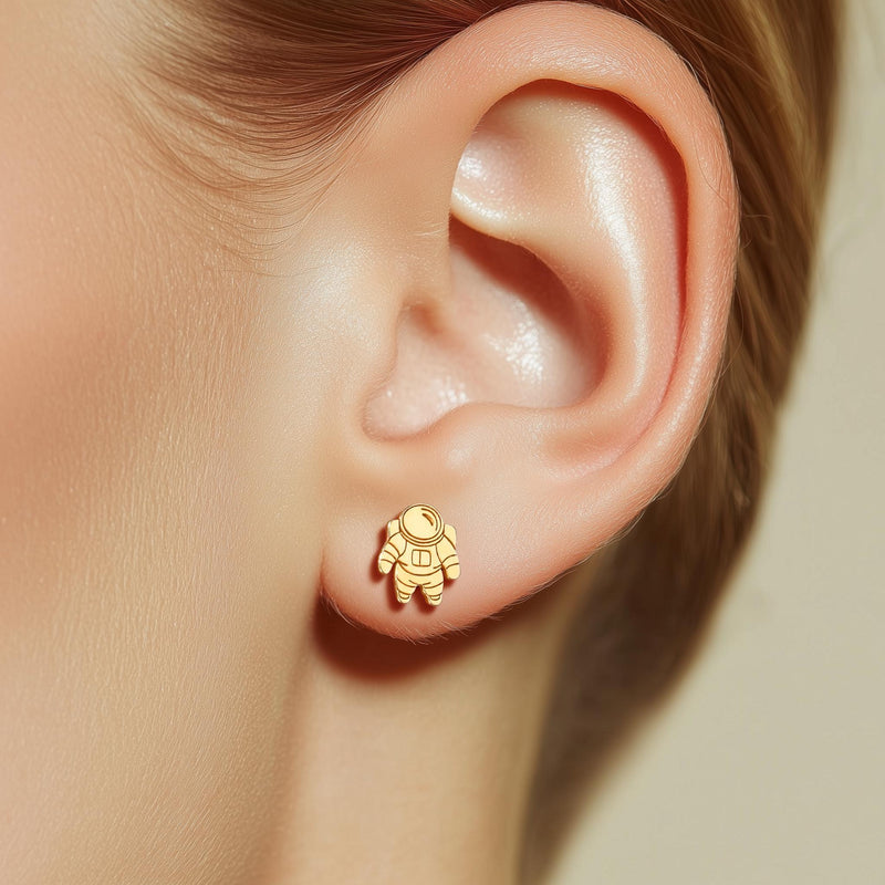 Pair of small gold astronaut stud earrings shown front on (5 of 14)
