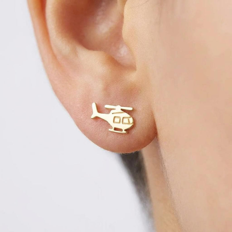 Pair of small gold helicopter stud earrings with visible rotors and skids