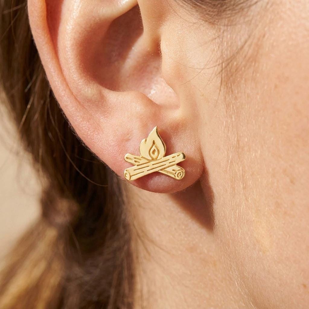 Pair of gold campfire stud earrings with crossed logs and a flame (2 of 12)
