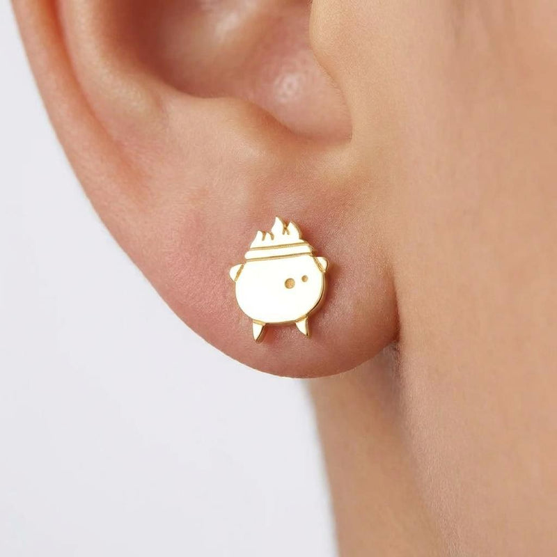 Pair of small gold witch cauldron stud earrings with a curved handle