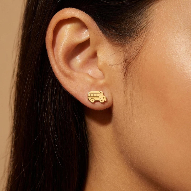 Pair of small gold school bus stud earrings with windows and wheels