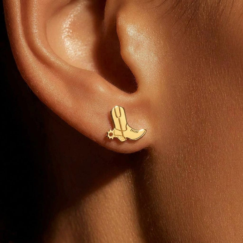 Tiny gold cowboy boot stud earrings with stitch detail on the shaft