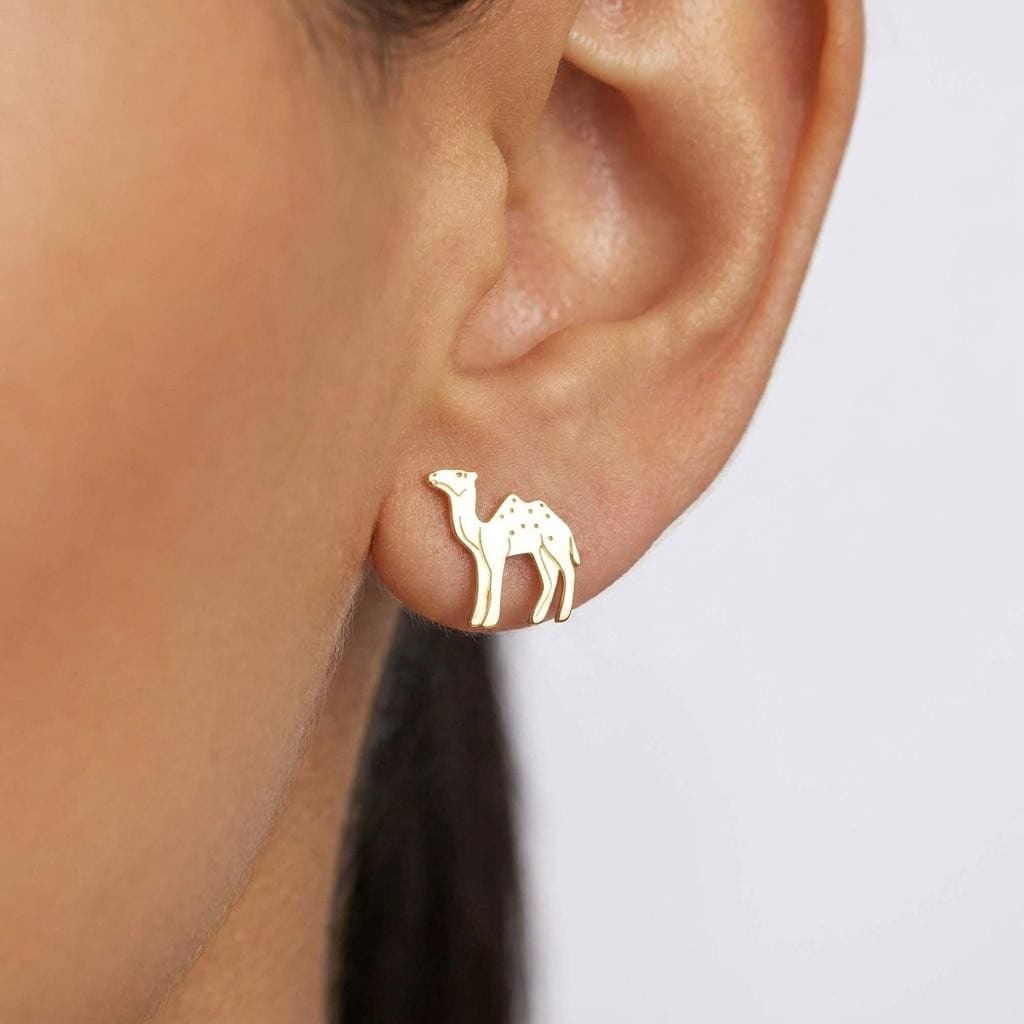 Pair of small gold camel stud earrings photographed on a white background. (2 of 8)