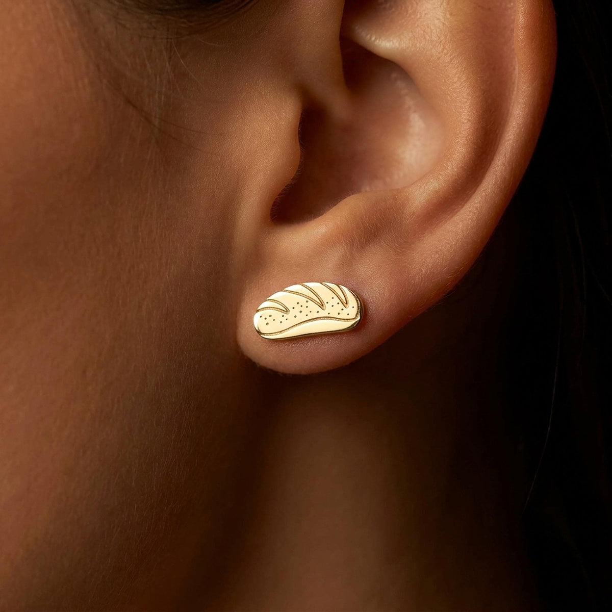 Pair of tiny bread loaf stud earrings in polished gold