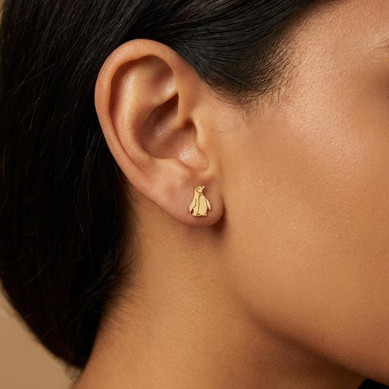 Pair of small gold penguin stud earrings with short flippers and a belly panel. (4 of 12)