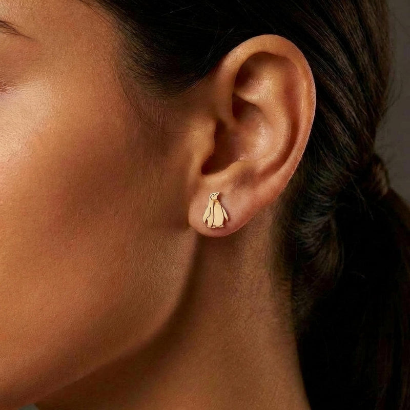 Pair of small gold penguin stud earrings with short flippers and a belly panel. (6 of 12)