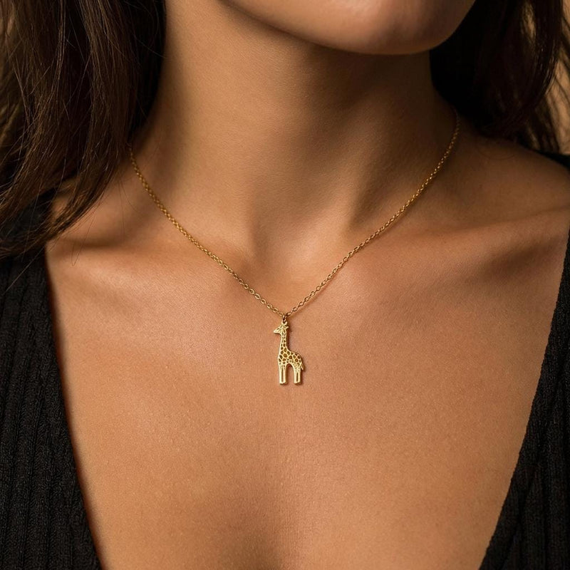 Fine gold chain necklace with a small standing giraffe pendant (5 of 10)