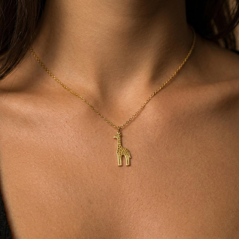 Fine gold chain necklace with a small standing giraffe pendant (7 of 10)