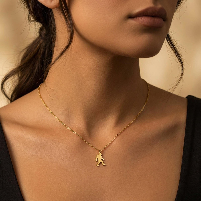 Fine gold chain necklace with a small walking Bigfoot sasquatch pendant (2 of 8)