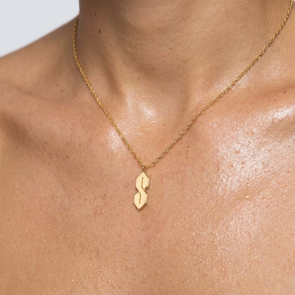 Fine gold chain necklace with an angular geometric S shaped pendant (2 of 10)
