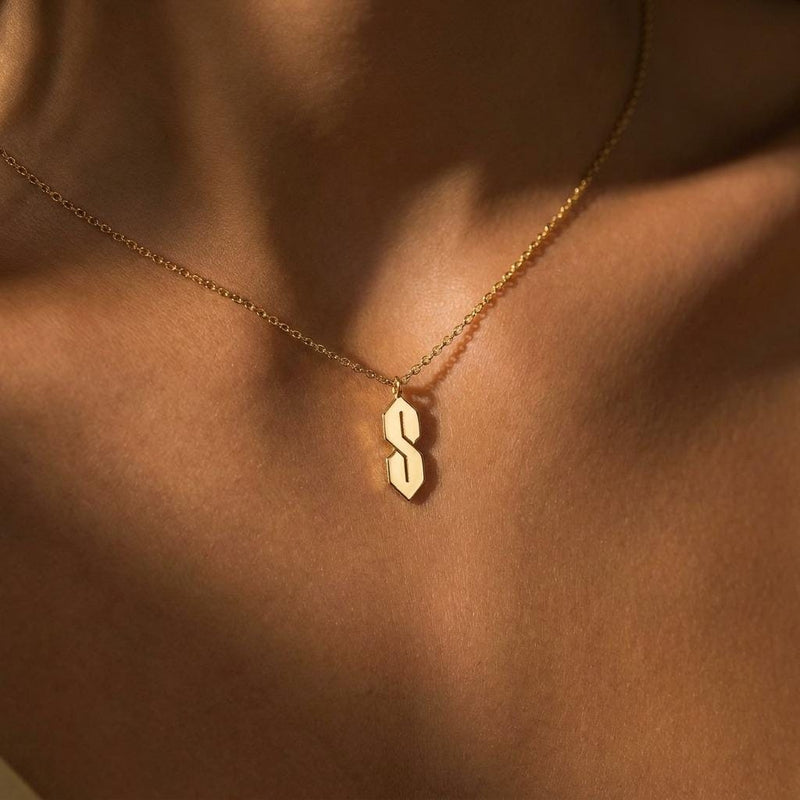 Fine gold chain necklace with an angular geometric S shaped pendant (7 of 10)