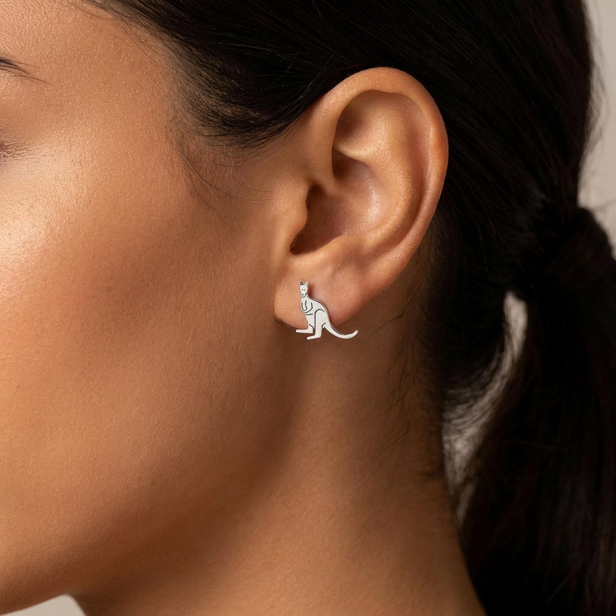 Pair of tiny gold kangaroo stud earrings with joey in pouch, white background. (2 of 12)
