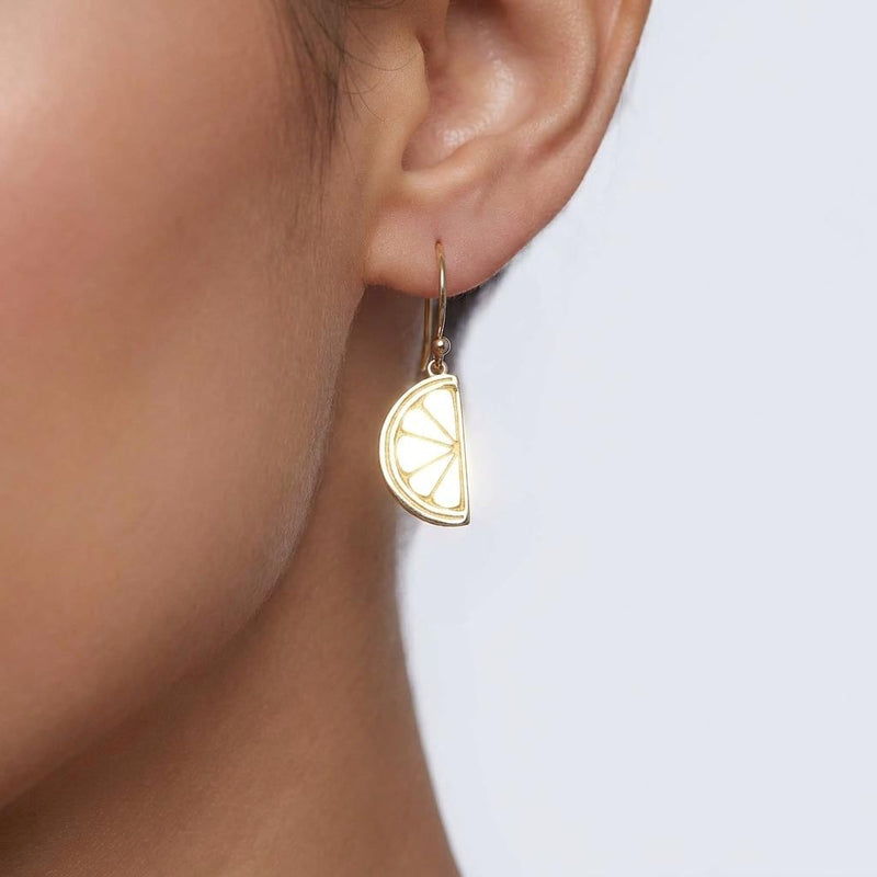Pair of small gold lemon stud earrings with a tiny leaf at the stem.