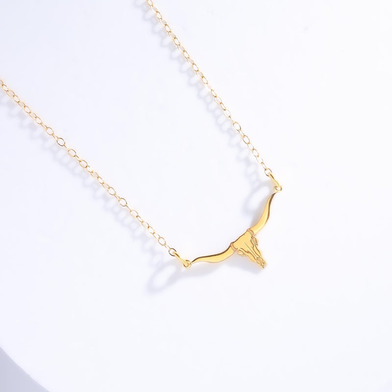 Fine gold chain necklace with a longhorn steer head pendant with wide horns