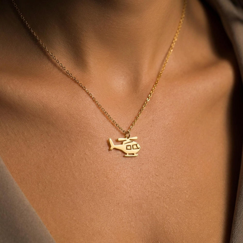 Small helicopter pendant in profile on a fine gold cable chain (2 of 7)
