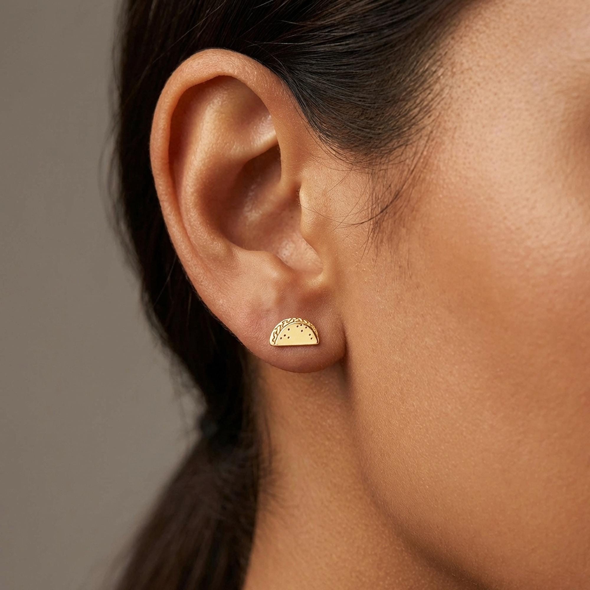 Small gold taco stud earrings, folded shell silhouette, shown as a pair (2 of 10)