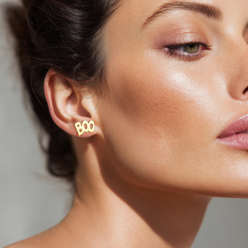 Pair of stud earrings spelling boo in rounded letters, in gold (3 of 8)