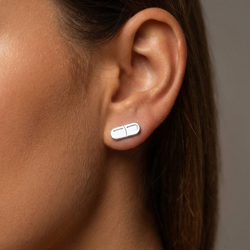 Pair of narrow gold capsule pill stud earrings with a seam across the middle (2 of 10)