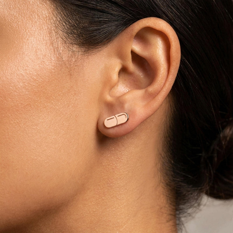 Pair of narrow gold capsule pill stud earrings with a seam across the middle (3 of 10)