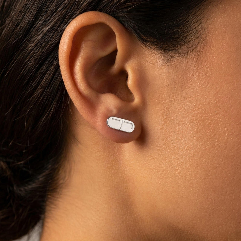Pair of narrow gold capsule pill stud earrings with a seam across the middle (5 of 10)