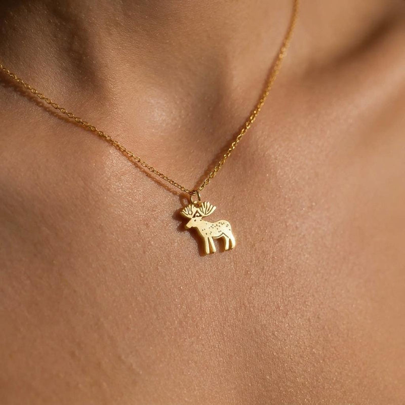 Dainty gold moose pendant with broad antlers on a fine chain