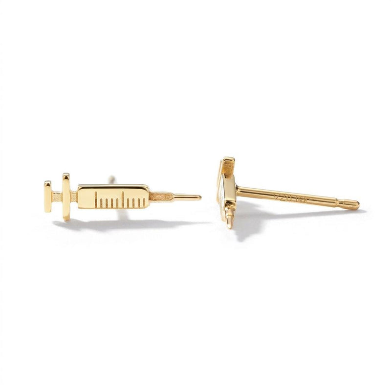 Pair of long thin gold syringe stud earrings with barrel and needle detail