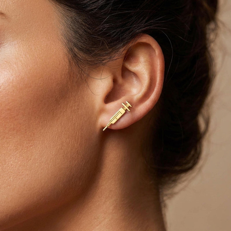 Pair of long thin gold syringe stud earrings with barrel and needle detail (4 of 9)