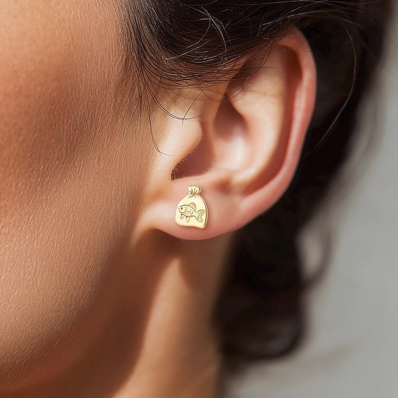 Pair of tiny goldfish stud earrings in gold shown side-on with a fanned tail (10 of 15)