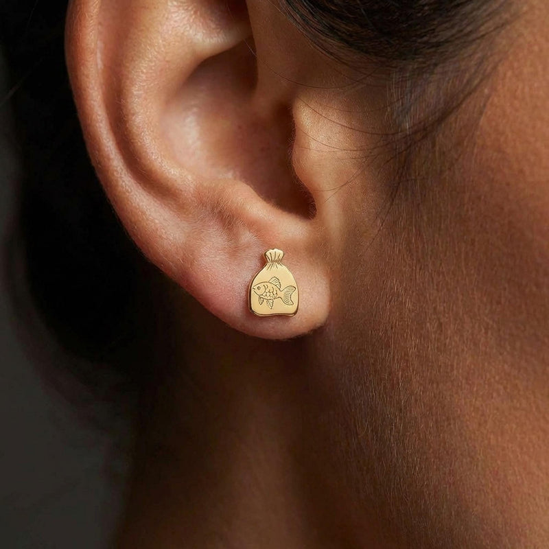 Pair of tiny goldfish stud earrings in gold shown side-on with a fanned tail (15 of 15)