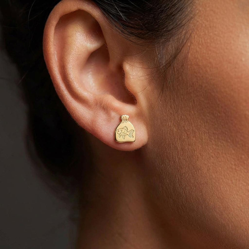 Pair of tiny goldfish stud earrings in gold shown side-on with a fanned tail (2 of 15)