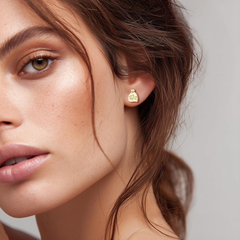 Pair of tiny goldfish stud earrings in gold shown side-on with a fanned tail (5 of 15)