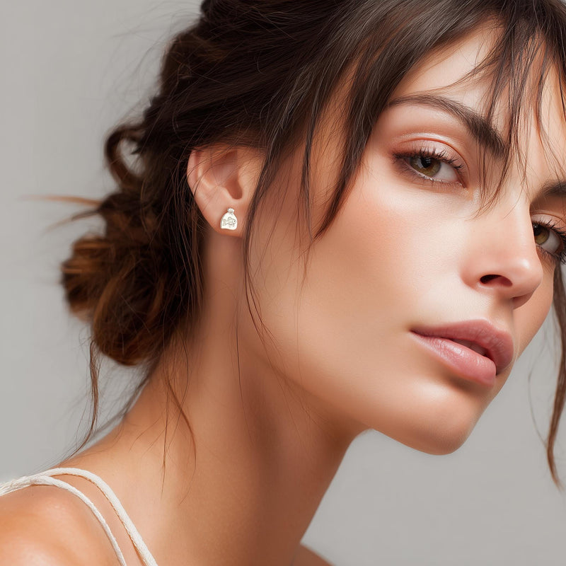 Pair of tiny goldfish stud earrings in gold shown side-on with a fanned tail (9 of 15)