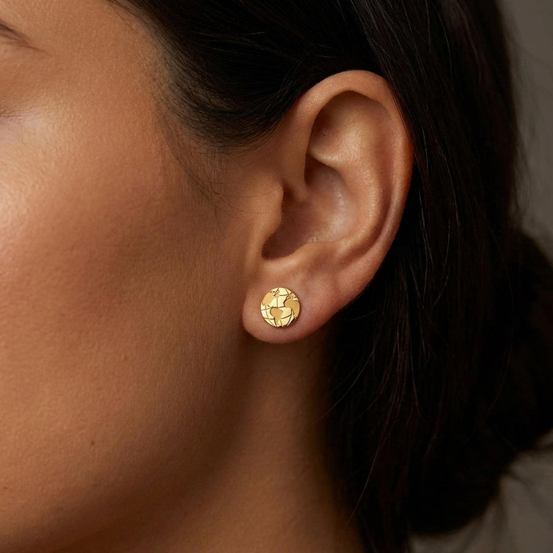 Pair of tiny round gold globe stud earrings with meridian lines, on white (11 of 12)