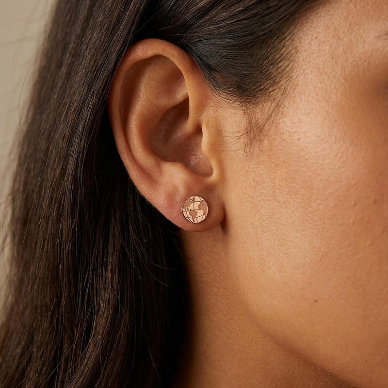 Pair of tiny round gold globe stud earrings with meridian lines, on white (12 of 12)