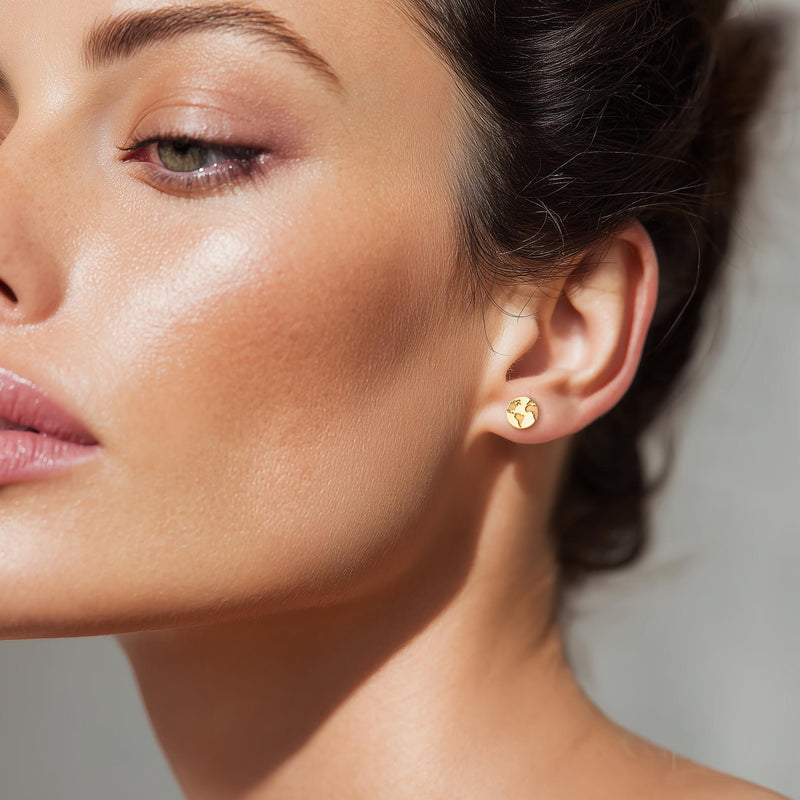 Pair of tiny round gold globe stud earrings with meridian lines, on white (5 of 12)