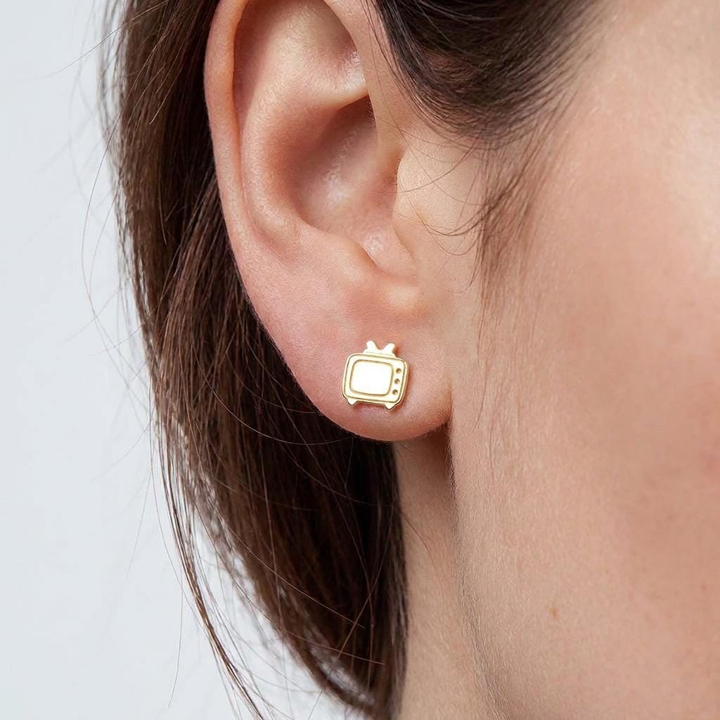 Pair of small gold retro television stud earrings with antenna ears