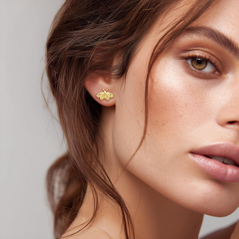 Small gold moth stud earrings with broad wings and feathered antennae (6 of 12)