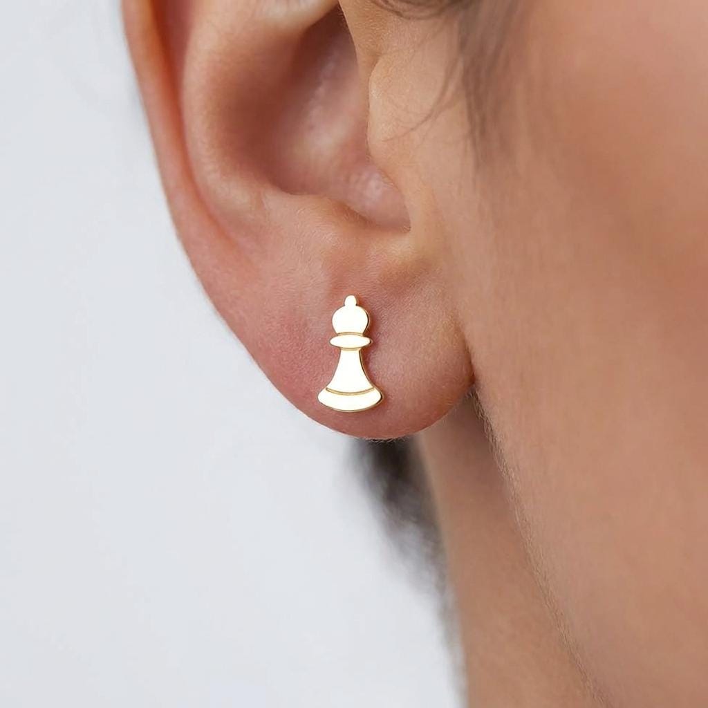 Set of gold chess piece stud earrings including knight, king and pawn, white background. (2 of 9)