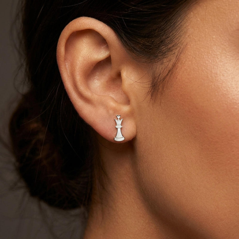 Pair of gold chess piece stud earrings shown in side profile (9 of 9)