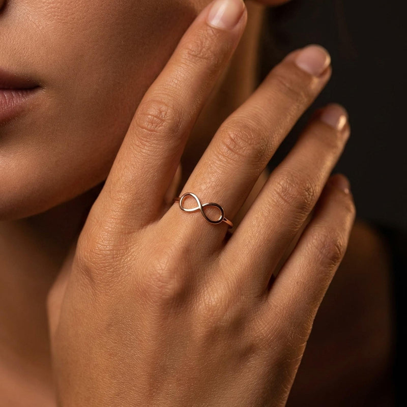 Thin gold infinity ring with a flat crossed loop on the band (5 of 10)
