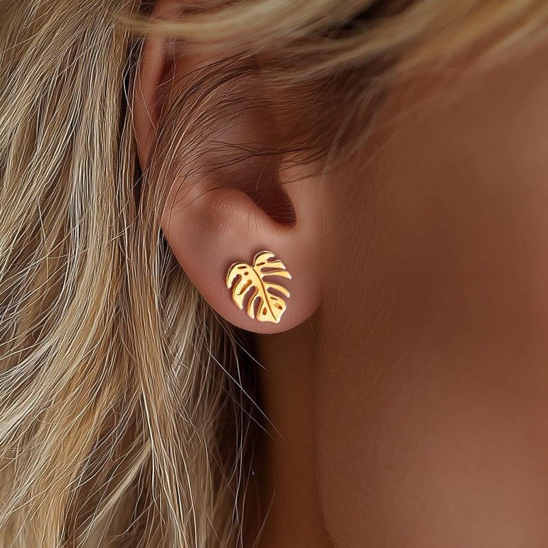 Tiny gold monstera leaf stud earrings with split leaf detail (10 of 10)