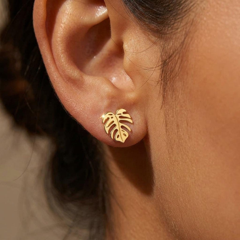 Tiny gold monstera leaf stud earrings with split leaf detail (5 of 10)