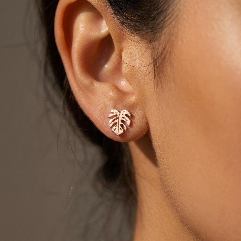Tiny gold monstera leaf stud earrings with split leaf detail (6 of 10)