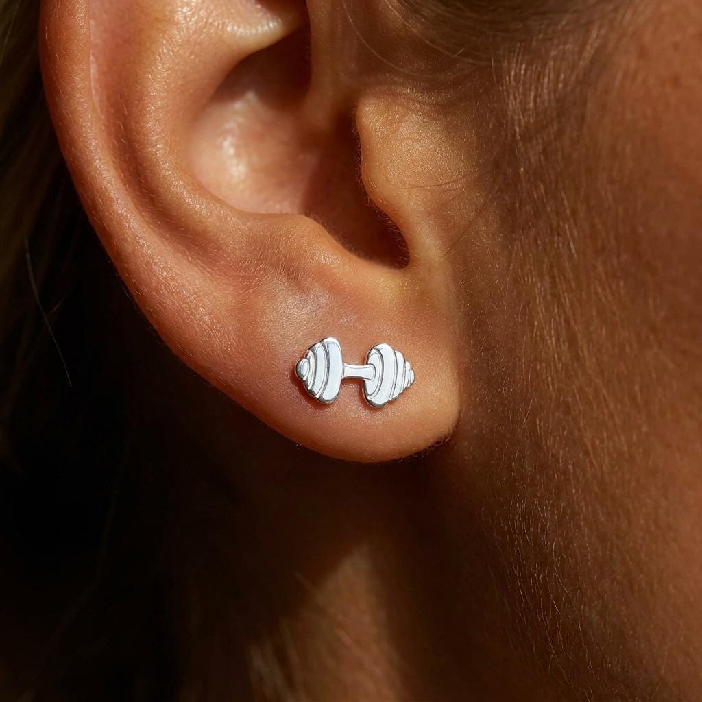 Pair of tiny dumbbell stud earrings in polished gold, shown upright with posts and backs (2 of 11)